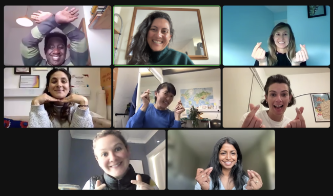 Eight people on individual computer screens, doing different hand gestures and smiling